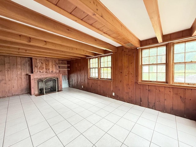 5391 Westport Rd, Madison, WI 53704 - unfurnished living room with a fireplace, beam ceiling, wood walls, and tile patterned flooring