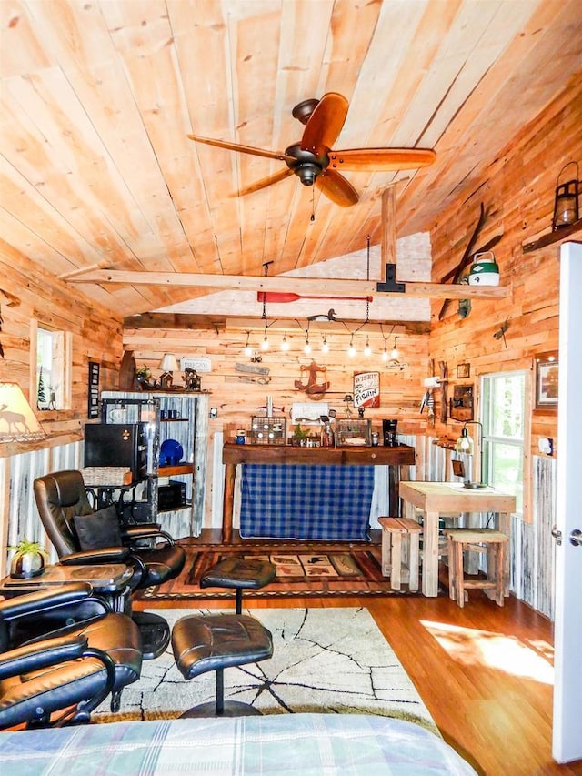 N12366 Chisum Trl, Athelstane, WI 54104 - living area with wood ceiling, wooden walls, vaulted ceiling, wood finished floors, and plenty of natural light