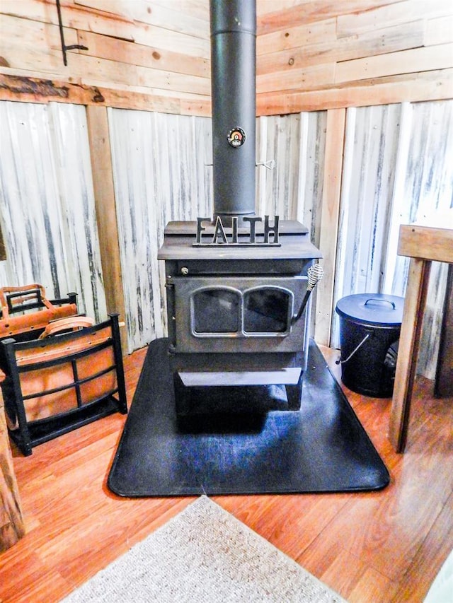 N12366 Chisum Trl, Athelstane, WI 54104 - detailed view of a wood stove, wood walls, and wood finished floors