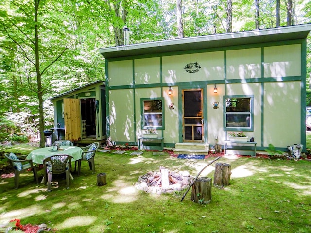 N12366 Chisum Trl, Athelstane, WI 54104 - back of house featuring entry steps and a lawn
