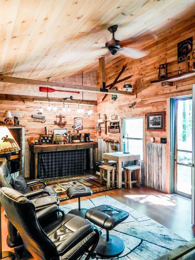 N12366 Chisum Trl, Athelstane, WI 54104 - living room with wood walls, wooden ceiling, healthy amount of natural light, wood finished floors, and a ceiling fan