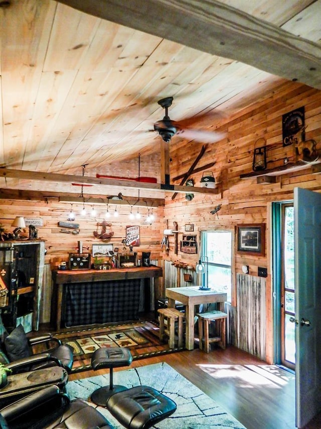 N12366 Chisum Trl, Athelstane, WI 54104 - living area with wood ceiling, wooden walls, lofted ceiling, hardwood / wood-style flooring, and a workshop area