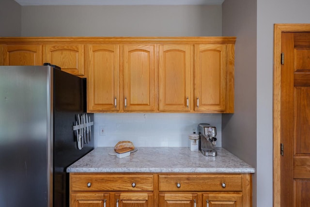 3637 121st Pl, Pleasant Prairie, WI 53158 - kitchen featuring freestanding refrigerator, tasteful backsplash, and light stone countertops