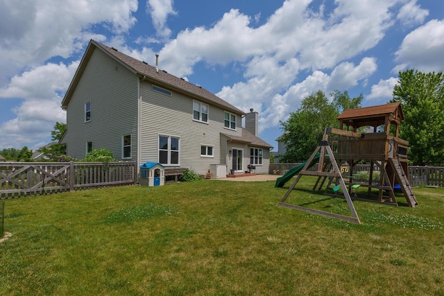3637 121st Pl, Pleasant Prairie, WI 53158 - back of property with a playground, a patio, a chimney, and a fenced backyard
