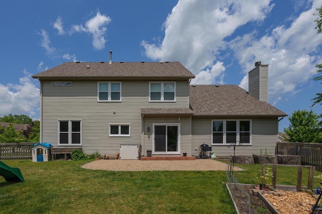 3637 121st Pl, Pleasant Prairie, WI 53158 - rear view of property with a patio area, a chimney, a shingled roof, and a garden