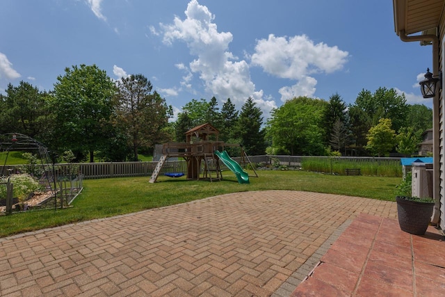 3637 121st Pl, Pleasant Prairie, WI 53158 - view of playground featuring a fenced backyard, a patio area, and view of wooded area