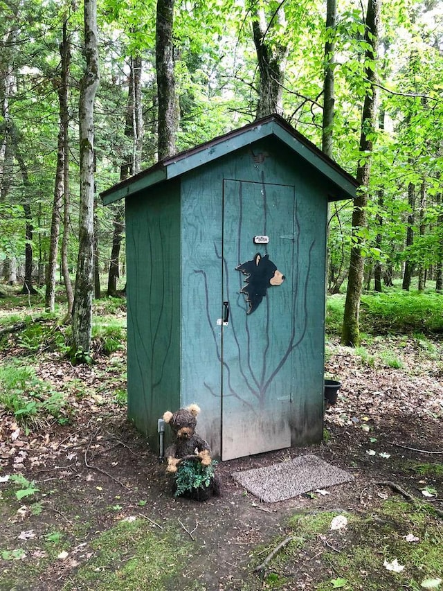 W15036 Poachers Run Ln, Athelstane, WI 54101 - view of shed featuring a forest view