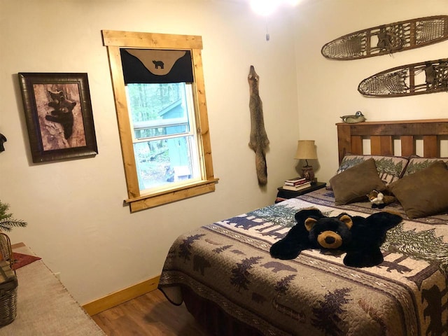 W15036 Poachers Run Ln, Athelstane, WI 54101 - bedroom featuring wood finished floors and baseboards