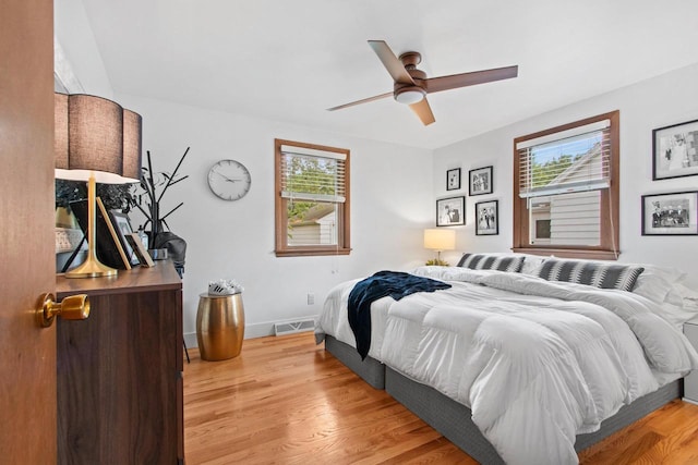 625 N Winnebago St, De Pere, WI 54115 - bedroom featuring multiple windows, wood finished floors, and ceiling fan