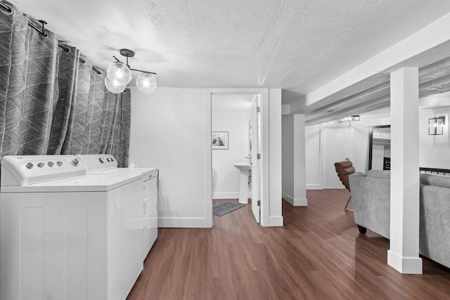 625 N Winnebago St, De Pere, WI 54115 - washroom with a textured ceiling, wood finished floors, and independent washer and dryer
