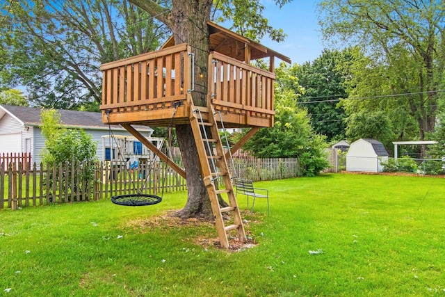 625 N Winnebago St, De Pere, WI 54115 - fenced backyard featuring a wooden deck and an outbuilding