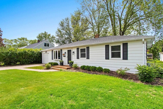 625 N Winnebago St, De Pere, WI 54115 - view of front of property with a front lawn, concrete driveway, and a chimney