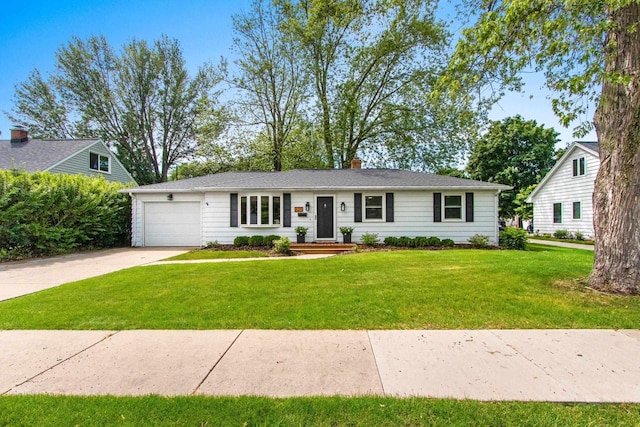 625 N Winnebago St, De Pere, WI 54115 - ranch-style house with an attached garage, driveway, a front yard, and a chimney