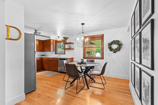 625 N Winnebago St, De Pere, WI 54115 - dining space with a chandelier and light wood-style floors