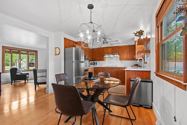 625 N Winnebago St, De Pere, WI 54115 - dining room with a chandelier and light wood-style floors