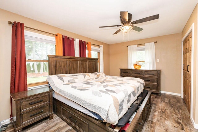 8383 N 50th St, Brown Deer, WI 53223 - bedroom featuring wood finished floors, multiple windows, and ceiling fan