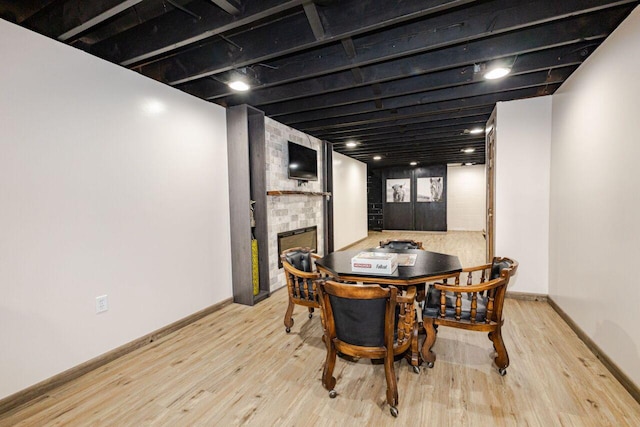 8383 N 50th St, Brown Deer, WI 53223 - dining space with a brick fireplace and wood finished floors