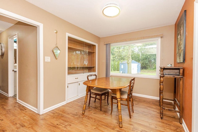 8383 N 50th St, Brown Deer, WI 53223 - dining space featuring light wood-type flooring and baseboards