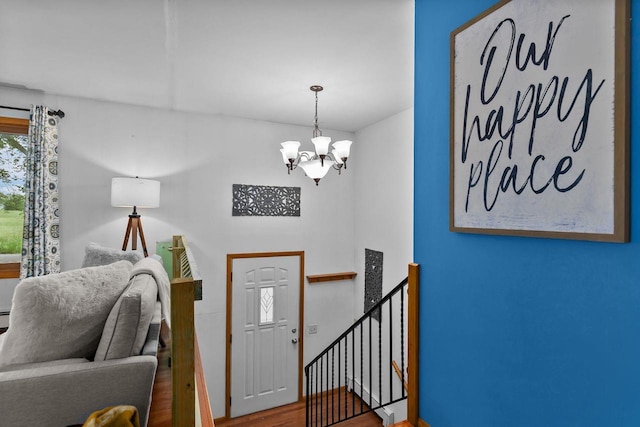 6610 Kelly Ln, Winneconne, WI 54986 - entrance foyer with a chandelier and wood finished floors