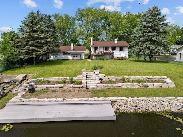6610 Kelly Ln, Winneconne, WI 54986 - rear view of property with a lawn and a wooden deck