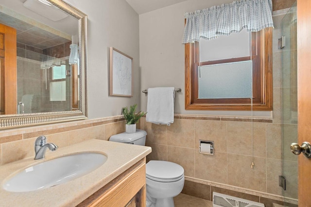 2939 W Roselawn Dr, Appleton, WI 54914 - full bathroom featuring tile walls, a stall shower, vanity, and wainscoting