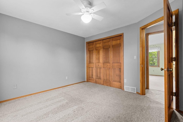 2939 W Roselawn Dr, Appleton, WI 54914 - unfurnished bedroom with carpet floors, a closet, and a ceiling fan