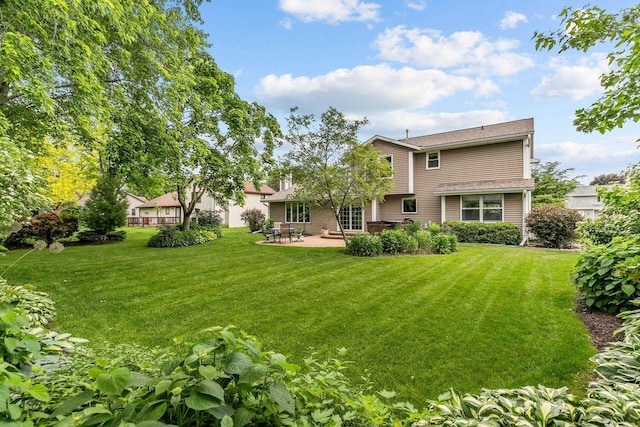 2939 W Roselawn Dr, Appleton, WI 54914 - rear view of property featuring a patio and a yard