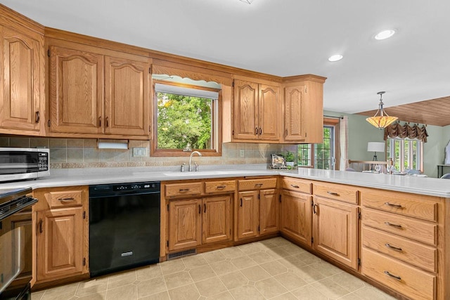 2939 W Roselawn Dr, Appleton, WI 54914 - kitchen featuring black appliances, plenty of natural light, light countertops, and recessed lighting