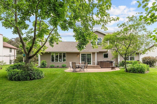 2939 W Roselawn Dr, Appleton, WI 54914 - rear view of house with a hot tub, a patio area, a lawn, and a shingled roof