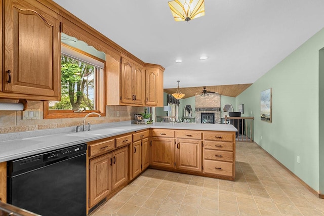 2939 W Roselawn Dr, Appleton, WI 54914 - kitchen featuring black dishwasher, light countertops, a peninsula, backsplash, and vaulted ceiling