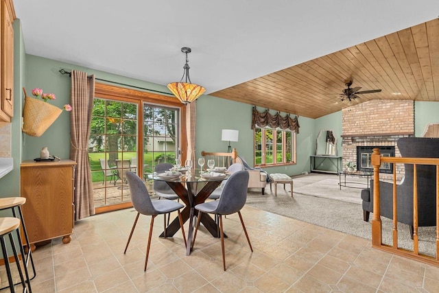 2939 W Roselawn Dr, Appleton, WI 54914 - dining space with plenty of natural light, lofted ceiling, ceiling fan, wooden ceiling, and a brick fireplace