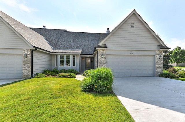 540 Mc Aurther Ln Unit B, Brookfield, WI 53045 - view of front facade featuring an attached garage, brick siding, a front yard, and a shingled roof