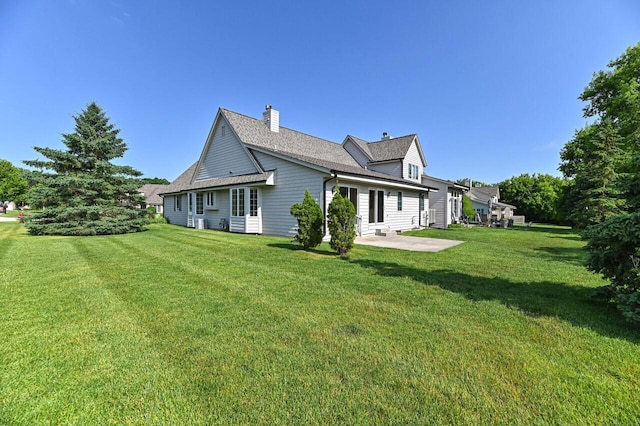 540 Mc Aurther Ln Unit B, Brookfield, WI 53045 - rear view of property with a yard, a patio, and a chimney