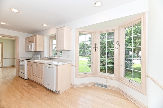 540 Mc Aurther Ln Unit B, Brookfield, WI 53045 - kitchen with white appliances, light wood-type flooring, light countertops, plenty of natural light, and recessed lighting