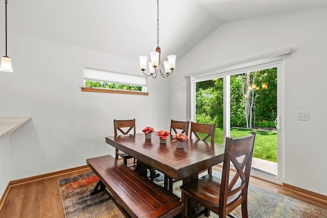 1734 Arthurs Pass, Oconomowoc, WI 53066 - dining area featuring lofted ceiling, a chandelier, and wood finished floors