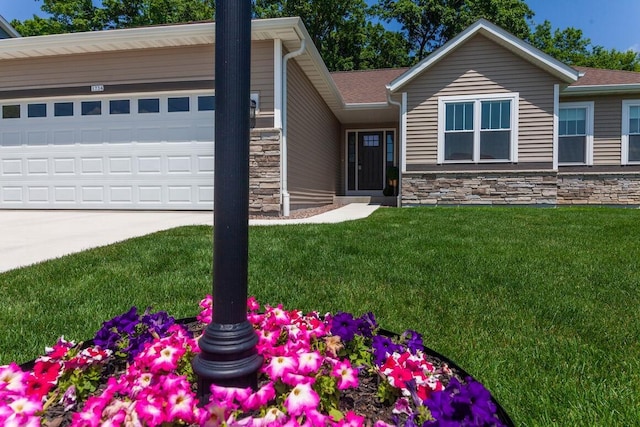 1734 Arthurs Pass, Oconomowoc, WI 53066 - view of front of house featuring stone siding, a front lawn, an attached garage, and concrete driveway