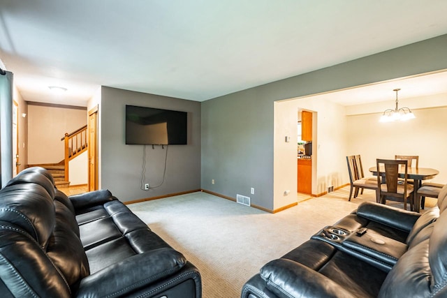 1615 Palamino Dr, Racine, WI 53402 - living area with stairs, carpet flooring, and a chandelier