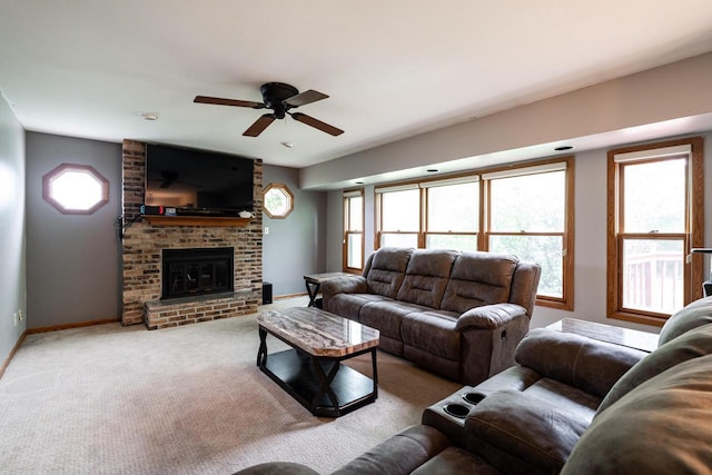 1615 Palamino Dr, Racine, WI 53402 - carpeted living room featuring a ceiling fan, a fireplace, and healthy amount of natural light