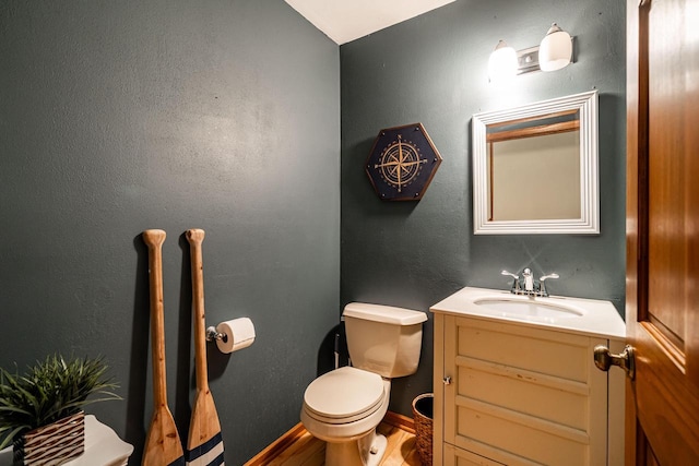 1615 Palamino Dr, Racine, WI 53402 - half bathroom featuring vanity and wood finished floors