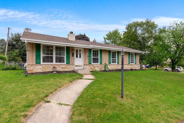 248 E Norport Dr, Port Washington, WI 53074 - ranch-style home with stone siding, a chimney, a front lawn, and board and batten siding