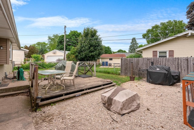 248 E Norport Dr, Port Washington, WI 53074 - view of yard featuring a wooden deck, outdoor dining area, and an outbuilding