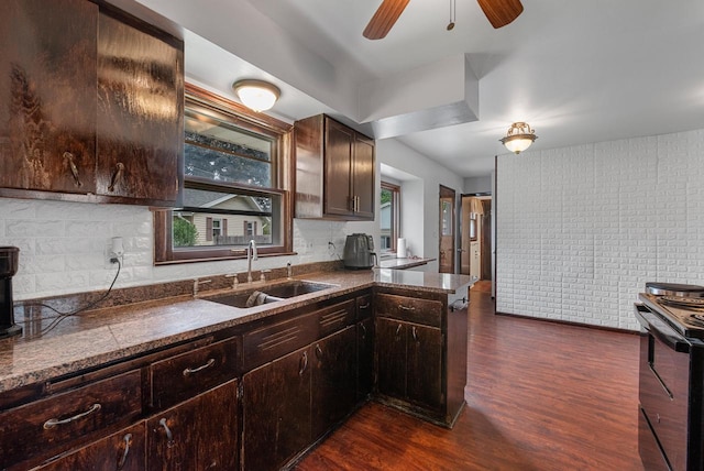 248 E Norport Dr, Port Washington, WI 53074 - kitchen featuring black / electric stove, dark countertops, and dark wood-style flooring