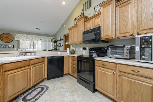 9245 S 54th St, Franklin, WI 53132 - kitchen with black appliances, vaulted ceiling, and light countertops