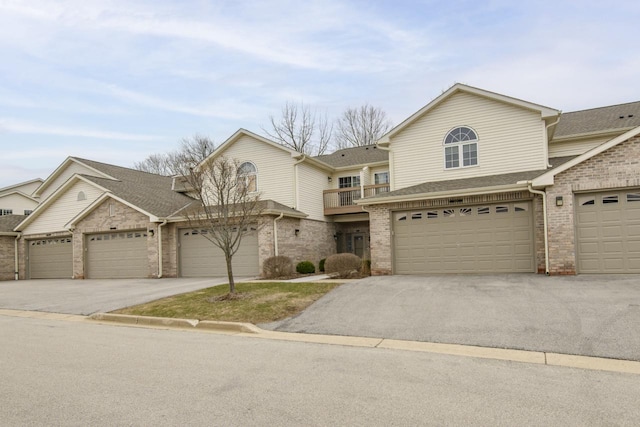 9245 S 54th St, Franklin, WI 53132 - townhome / multi-family property featuring brick siding, driveway, and roof with shingles