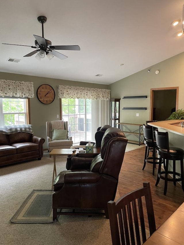 9245 S 54th St, Franklin, WI 53132 - living area featuring plenty of natural light, ceiling fan, recessed lighting, lofted ceiling, and wood finished floors
