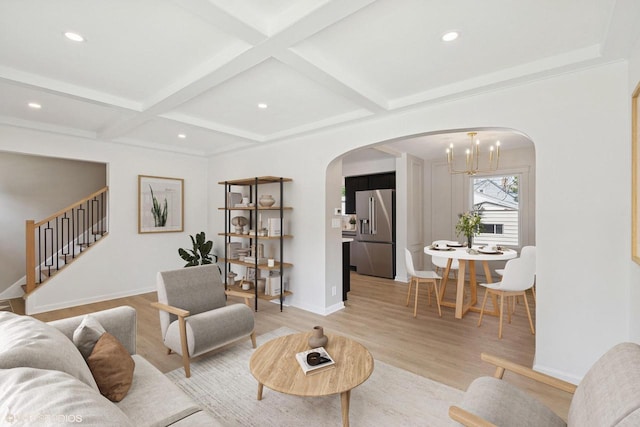 832 E Wilbur Ave, Milwaukee, WI 53207 - living area featuring arched walkways, a chandelier, stairs, light wood-style floors, and beamed ceiling