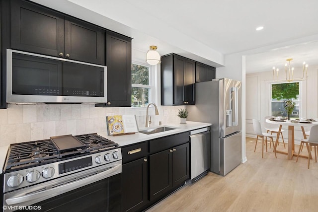 832 E Wilbur Ave, Milwaukee, WI 53207 - kitchen featuring stainless steel appliances, light wood-style floors, plenty of natural light, light countertops, and recessed lighting