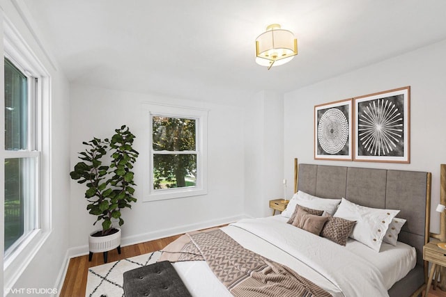 832 E Wilbur Ave, Milwaukee, WI 53207 - bedroom with multiple windows and wood finished floors