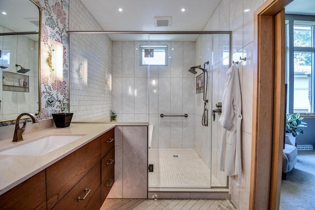 6846 Frank Lloyd Wright Ave, Middleton, WI 53562 - full bathroom with vanity, plenty of natural light, a stall shower, and recessed lighting