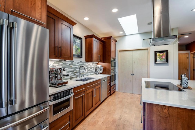 6846 Frank Lloyd Wright Ave, Middleton, WI 53562 - kitchen featuring appliances with stainless steel finishes, a skylight, light countertops, decorative backsplash, and recessed lighting